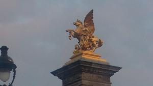 One of the golden statues watching over the Pont Alexander