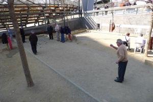 Googling "barcelona street game where old men throw metal balls" tells us this is called Petanque. -- Photo credit: Ryan Liwanag