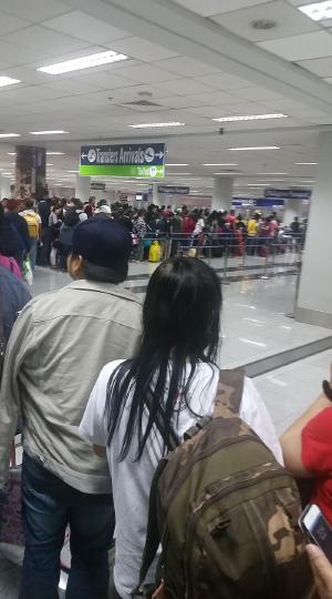 Immigration queue. Looks like only 4 counters manned